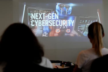 Cyber security company Kaspersky Lab runs a presentation on the risks companies face from hacking in Dubai. Pawan Singh / The National