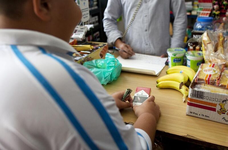 An increase in the price of a packet of cigarettes will deter young people from buying them, health chiefs say. Christopher Pike / The National