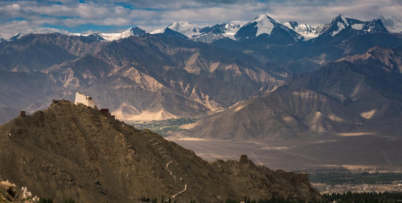 Namgyal tsemo monastery on top of the hill and leh palace at the edge of the cliff with snowcap mountain range in background at the heart of leh town in ladakh region northern part of Jammu Kashmir in india. Getty Images