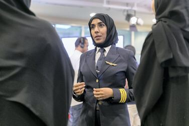 Salma al Baloushi, Etihad Airways' first female pilot, talks to new recruits. Etihad Airways is among a group of 59 global airlines pledging to increase the number of women in senior positions by 2025. Reem Mohammed / The National