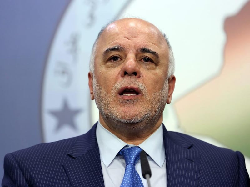 Haider Al Abadi speaks to the media after an Iraqi parliament session in Baghdad on July 15, 2014. Mr Al Abadi, the deputy speaker, was chosen on August 11, 2014, by Iraq's largest coalition of Shiite political parties as its candidate for prime minister. Hadi Mizban / AP Photo