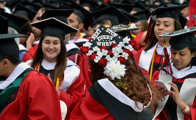 A student wears a mortar board reading 'Next Stop Everywhere' as she graduates from Rutgers University in New Jersey, US. Reuters 
