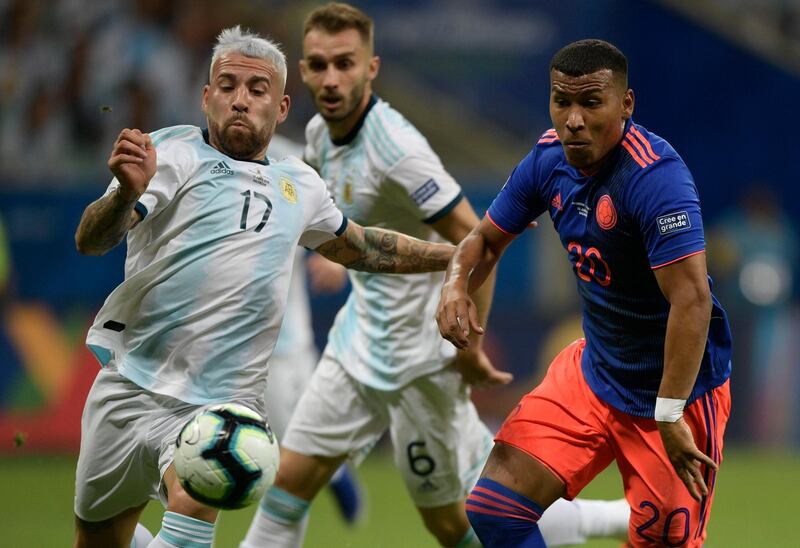 Argentina's Nicolas Otamendi, left, and Colombia's Roger Martinez vie for the ball. AFP