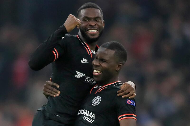 Chelsea central defenders Kurt Zouma, right and Fikayo Tomori celebrate at the end of the game. AP Photo