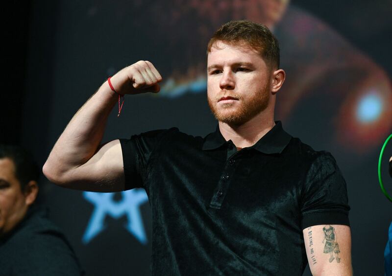 Saul "Canelo" Alvarez poses for photos during a press conference. AFP