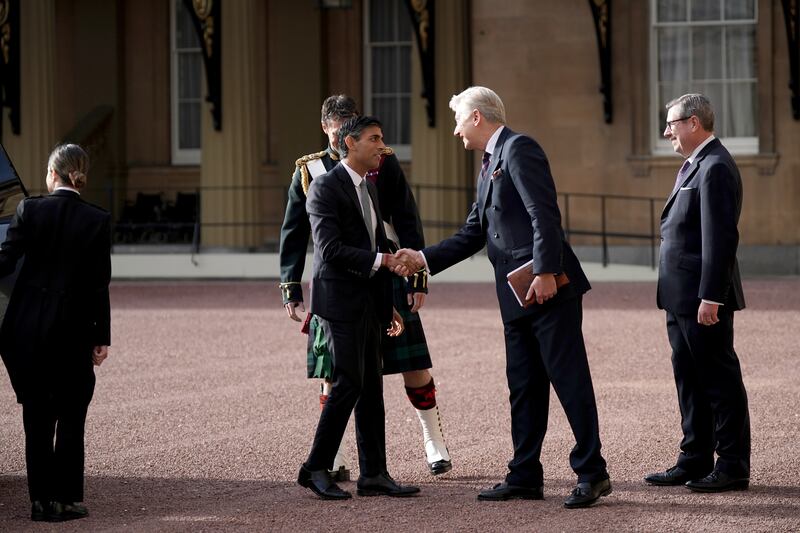 Mr Sunak arrives at Buckingham Palace. PA