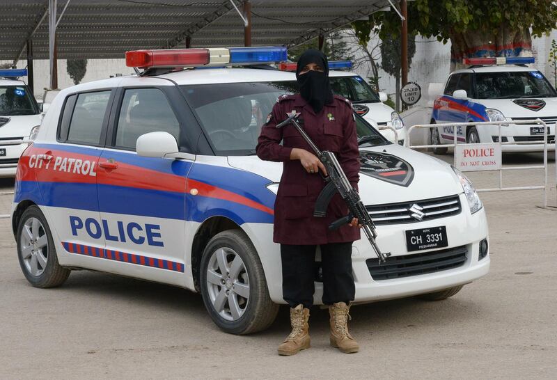 Zahida, a Pakistani female police Assistance Sub-Inspector (ASI), poses for a photograph at a police academy in Peshawar. Abdul Majeed / AFP Photo