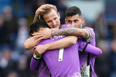 Tottenham Hotspur's Son Heung-min, foreground, celebrates with Harry Kane, centre, and Cristian Romero after scoring their side's fourth goal of the game, during the English Premier League soccer match between Leeds United and Tottenham Hotspur, in Leeds, England, Saturday, Feb.  26, 2022.  (Zac Goodwin / PA via AP)