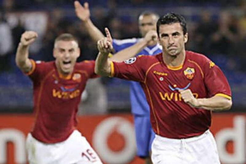 AS Roma's Christian Panucci, right, celebrates with his teammate Daniele De Rossi  after scoring against Chelsea during their Champions League match.