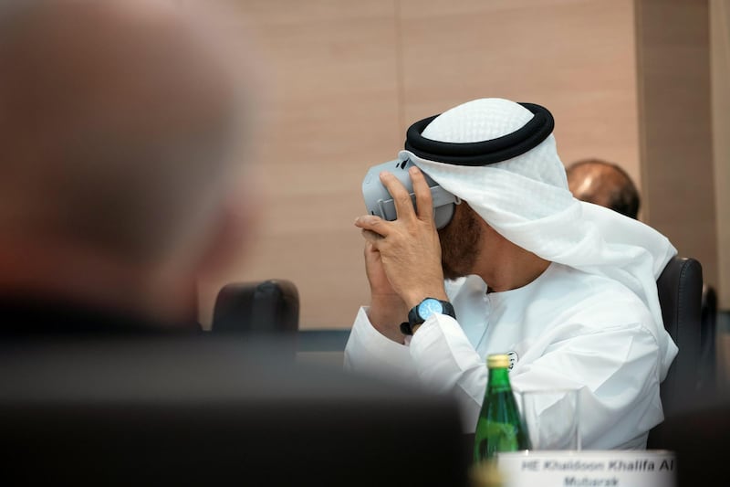 SINGAPORE, SINGAPORE - February 28, 2019: HH Sheikh Mohamed bin Zayed Al Nahyan, Crown Prince of Abu Dhabi and Deputy Supreme Commander of the UAE Armed Forces (L), looks through a virtual reality goggles, during a meeting, at Mubadala's GLOBALFOUNDRIES semiconductor facility.
( Ryan Carter for the Ministry of Presidential Affairs )
---