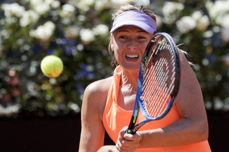 Maria Sharapova returns a shot to Christina Mchale during the Italian Open tennis tournament in Rome on May 15, 2017. Andrew Medichini / AP Photo