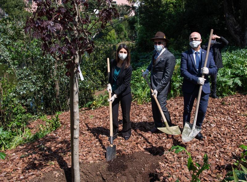 The mayor of Rome, Virginia Raggi, left, Bahrain's ambassador to Italy, Nasser Al Belooshi, centre, and Dror Eydar, Israel's ambassador to Italy, during a ceremony to mark World Earth Day. They planted a 'Crimson King' on the shores of the pond of the Biopark of Rome, Italy. Earth Day, proclaimed by the United Nations in 2009, is observed around the world on April 22 each year to raise awareness and appreciation for the Earth's environment. The theme of Earth day this year is 'Restore Our Earth'. EPA