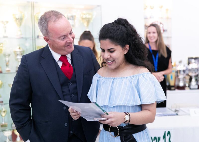 DUBAI, UNITED ARAB EMIRATES. 15 AUGUST 2019. 
Manal Riza Mohammed,18, receives her A-Level results, with the Prinicipal Simo O’Connor, at Jumeirah College school.
(Photo: Reem Mohammed/The National)

Reporter:
Section: