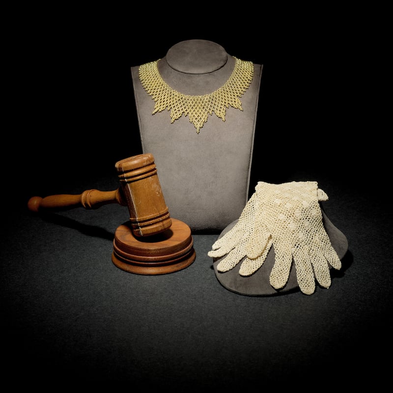 Late US Supreme Court justice Ruth Bader Ginsburg's collar, gavel and gloves are among many of her items being auctioned online, starting on September 7. Photo: Bonhams