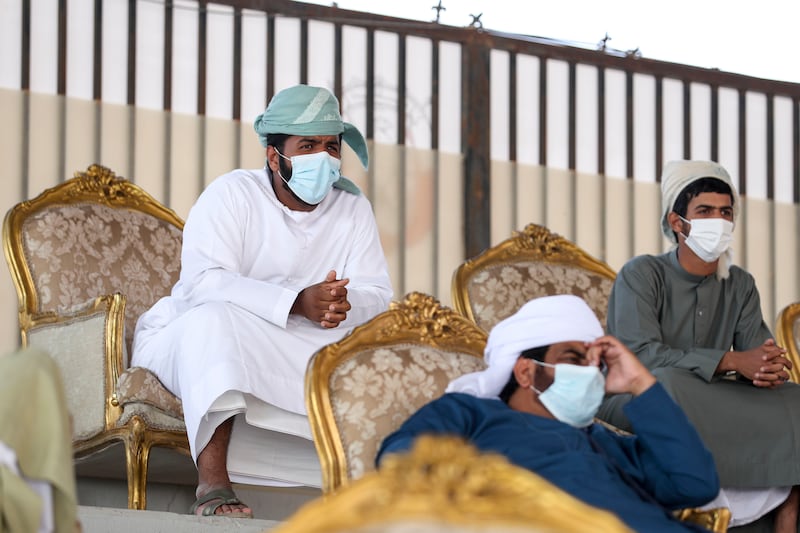 Camel breeders watch the competition closely.