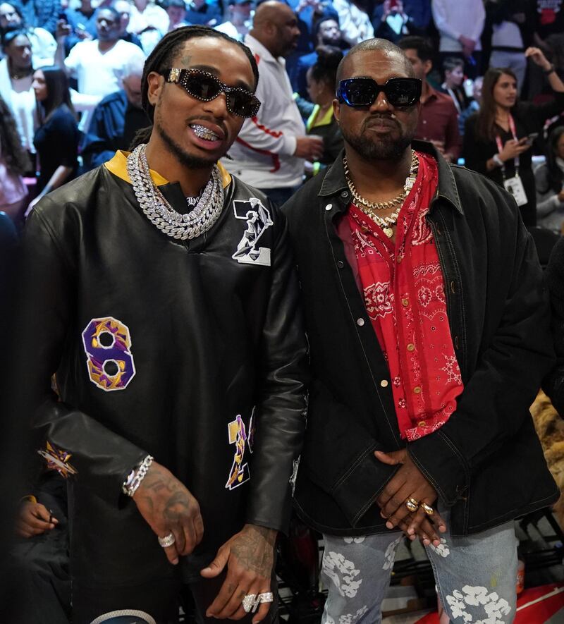 Quavo and Kanye West watch the action.Kyle Terada-USA TODAY