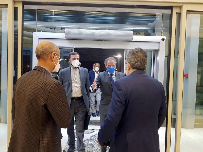 IAEA chief, Rafael Grossi, second right, is welcomed by deputy head of Iran's Atomic Energy Organisation, Behrouz Kamalvandi, right, as he is accompanied by Iran's envoy to the IAEA, Kazem Gharibabadi, second left. AP
