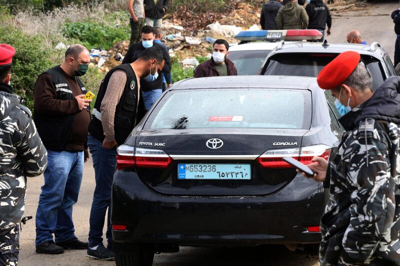 Lebanese security forces inspect the car in which Lokman Slim was found dead on February 4, 2021. AFP