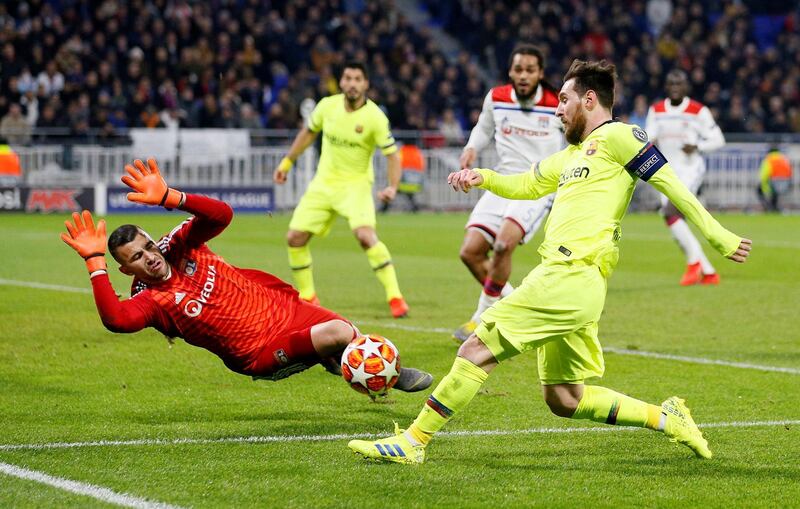 Lyon's Anthony Lopes makes a save from Barcelona's Lionel Messi. Reuters