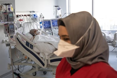 A medic tends to a Covid-19 patient at the Ankara City Hospital's intensive care unit on October 5, 2020, in the Turkish capital. Getty 