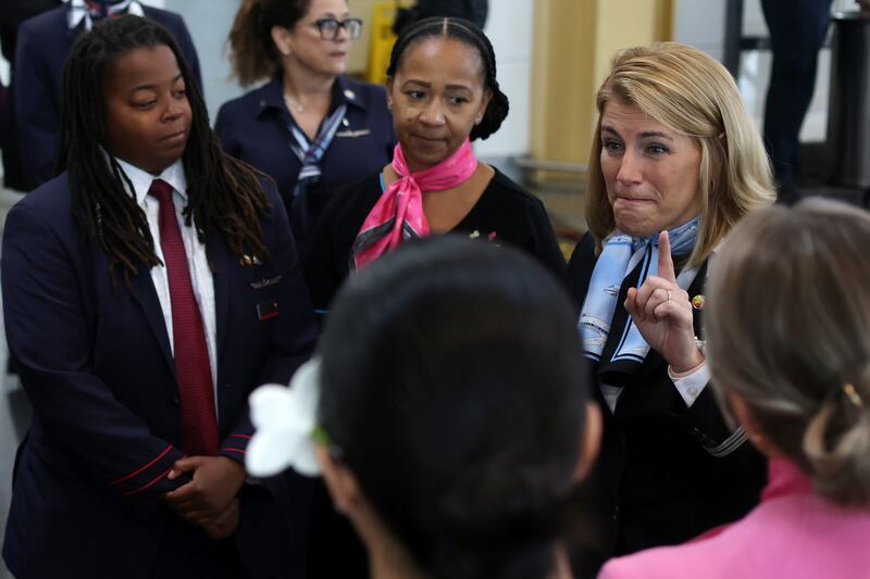 Ms Nelson speaks to fellow flight attendants.