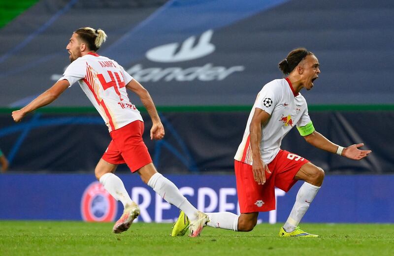 Leipzig's Yussuf Poulsen, right, and teammate Kevin Kampl celebrate after their team's Champions League quarterfinal win over Atletico Madrid. AP