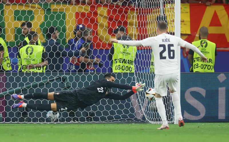 Portugal keeper Diogo Costa of saves the first penalty from Josip Ilicic of Slovenia in the penalty shoot-out. Getty Images