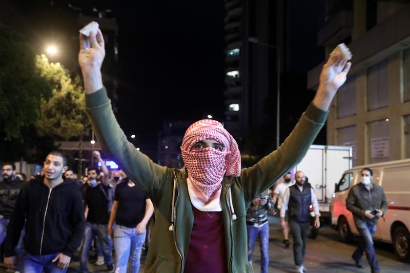 A demonstrator gestures during an anti-government demonstration outside the headquarters of the Lebanese central bank in Beirut. 
 Bloomberg