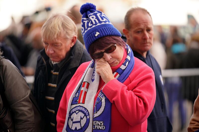 A fan wipes away a tear. Getty Images