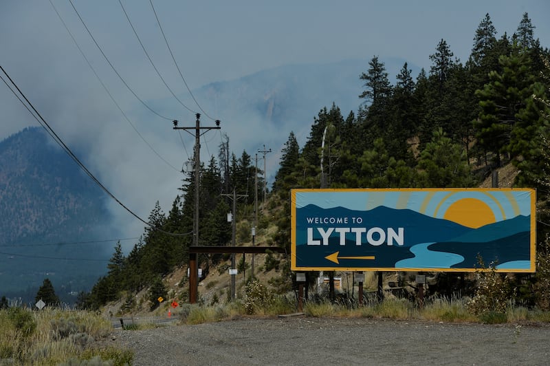 The sign for the town of Lytton, where a wildfire raged through and forced residents to evacuate, is seen in Lytton, British Columbia.