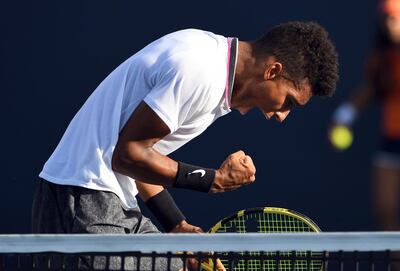 Felix Auger-Aliassime, of Canada, celebrates a point against Hubert Hurkacz, of Poland, during the Miami Open tennis tournament Sunday, March 24, 2019, in Miami Gardens, Fla. (AP Photo/Jim Rassol)