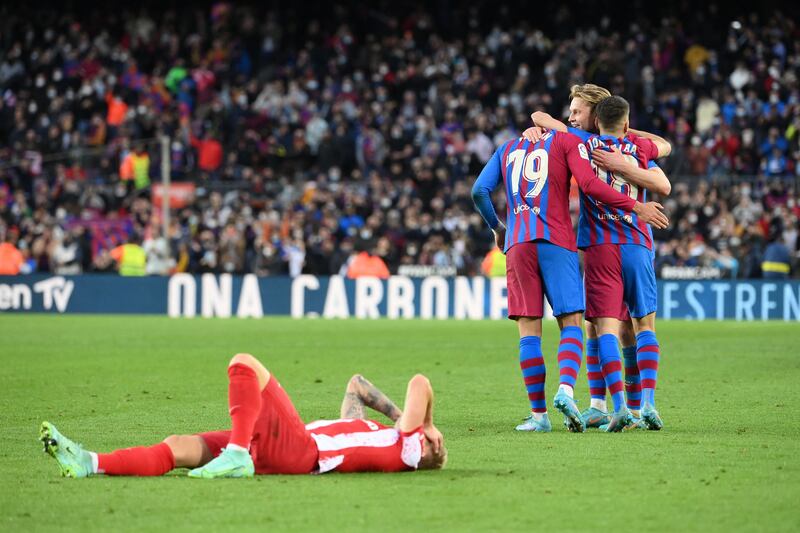 Barcelona players celebrate their victory at the end of the match. AFP