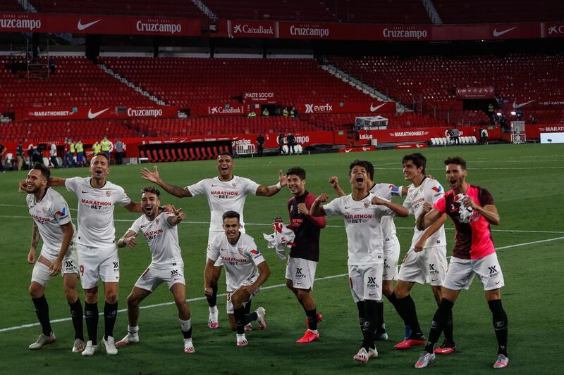 Sevilla players celebrate after the match. AP