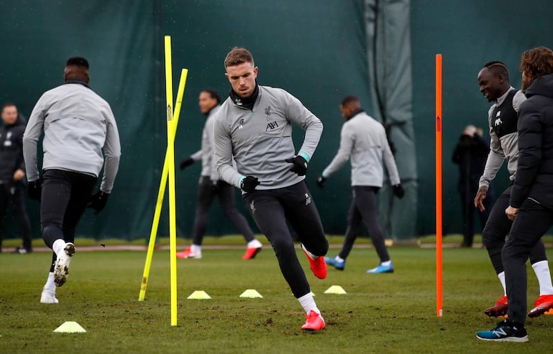 Liverpool's Jordan Henderson, centre. PA