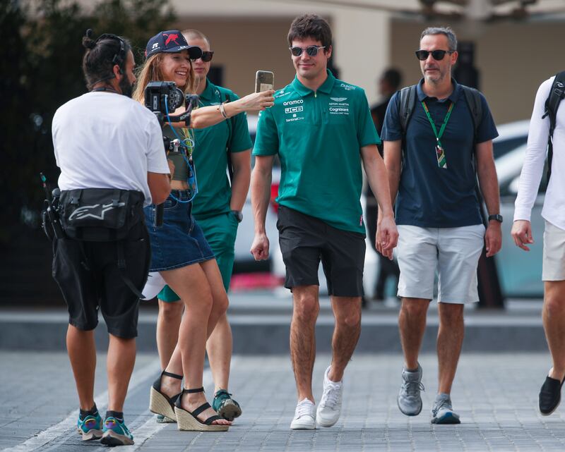 Lance Stroll of Aston Martin arrives at Yas Marina Circuit on the final day  of the Abu Dhabi Grand Prix 2022. Victor Besa / The National