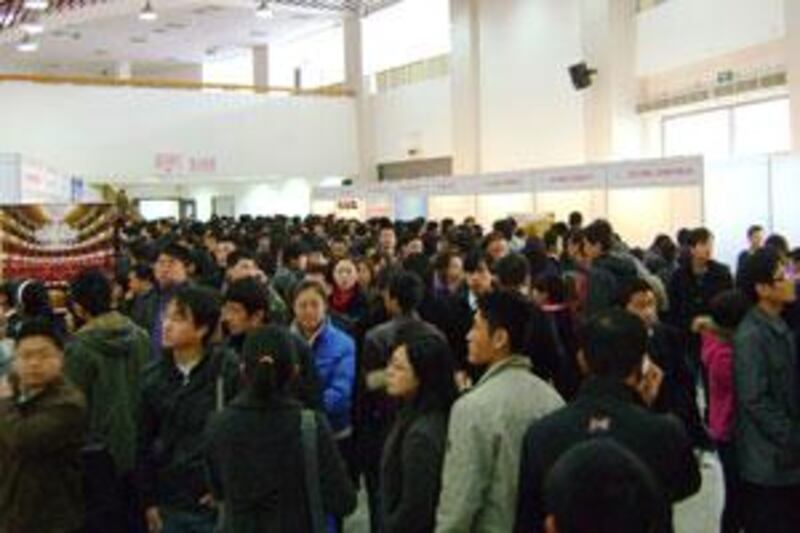 Graduates looking for work throng the Talents Job Fair in Beijing.