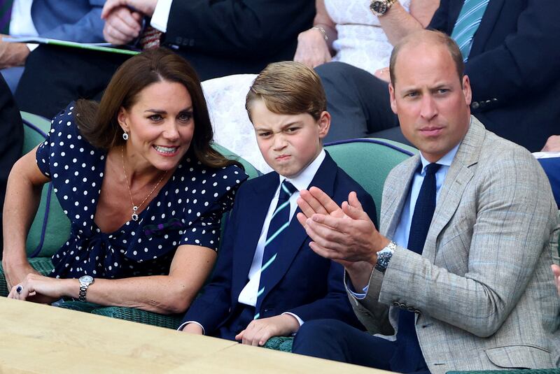 Prince George watches the men's singles final at the Wimbledon tennis championships in London with his parents, earlier in July. Reuters