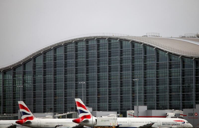 British Airways aircraft in front of Heathrow's Terminal 5 which has been built at the Western end of London Heathrow in between the airports two runways Courtesy British Airways