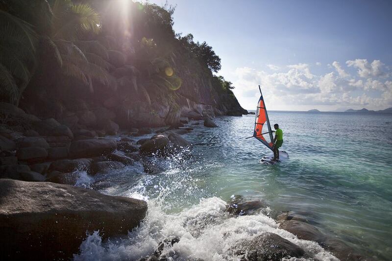 A guest tries out windsurfing at the The Four Seasons Seychelles hotel, which is located on Mahe, the largest of the 115 islands that comprises the Republic of Seychelles. Silvia Razgova / The National