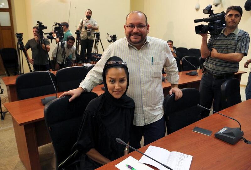 A picture made available on 25 July 2014 shows the Washington Post Iranian-American journalist Jason Rezaian (R) and his Iranian wife Yeganeh Salehi, who works for the UAE newspaper The National, during a foreign ministry spokeswoman weekly press conference in Tehran on September 10, 2013. EPA