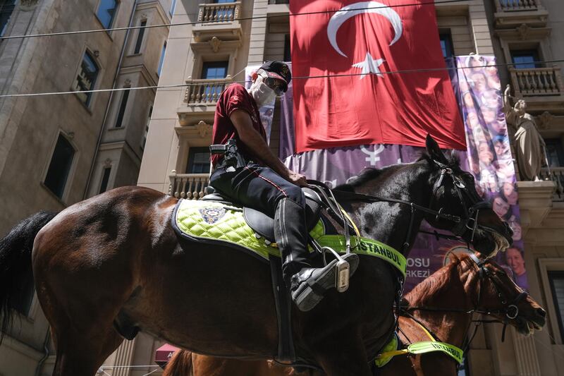 Turkish mounted police patrol at Istiklal Street during the lockdown in Istanbul. EPA