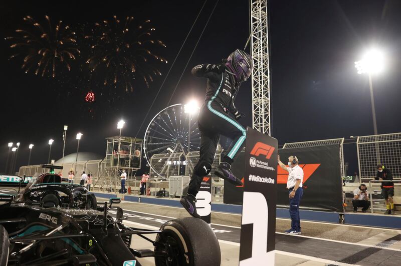 Mercedes driver Lewis Hamilton celebrates after winning the Bahrain GP in Sakhir on Sunday, March 28. AP