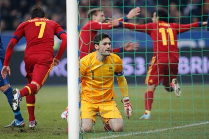 Spain's players celebrate after Pedro's winning goal beat France goalkeeper Hugo Lloris.