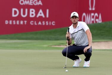 Thomas Pieters on the 9th green on Thursday on his way to a 67 and a one-shot lead on Day 1 of the Omega Dubai Desert Classic. Chris Whiteoak / The National