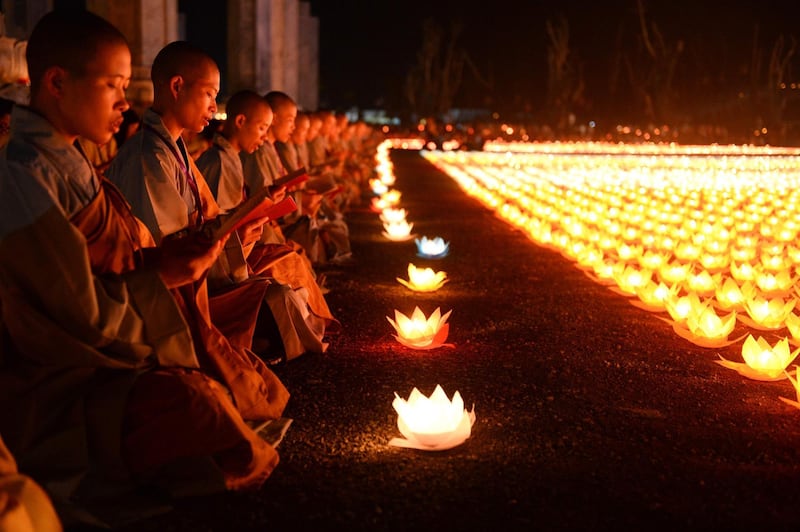 Buddhist nuns pray during a ceremony at the Tam Chuc pagoda in Ha Nam province for Vesak Day celebrations. AFP