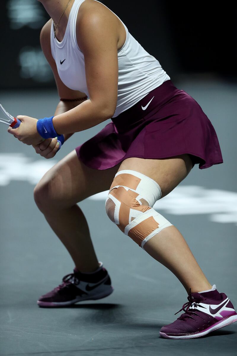 The heavilly strapped left knee of Bianca Andreescu. Getty