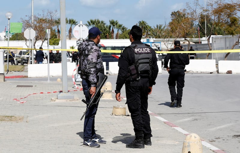 Members of security forces stand guard at the site of a suicide attack near the US embassy in Tunis. Reuters