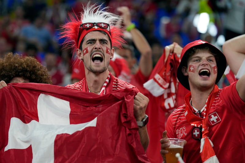 Swiss cheers. AP Photo