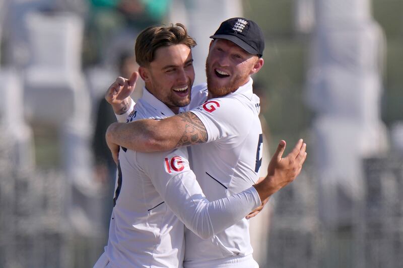England's Will Jacks, left, celebrates with Ben Stokes after taking the wicket of Pakistan opener Abdullah Shafique. AP