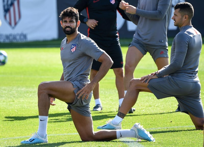 Atletico Madrid's Spanish forward Diego Costa stretching during training on Tuesday. AFP
